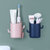 卫生间牙刷置物架壁挂式沥水免打孔浴室洗漱台梳子牙膏筒收纳筒(两个装（粉+蓝）)
