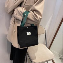 秋季手提袋2021新款上班包包女帆布包通勤简约带饭盒包小拎手拎包(黑色 默认版本)